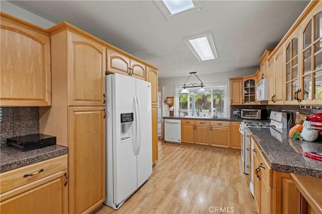 21643 Spice Ct, Saugus, CA 91350 - kitchen with white appliances, decorative backsplash, light wood-style flooring, and glass insert cabinets