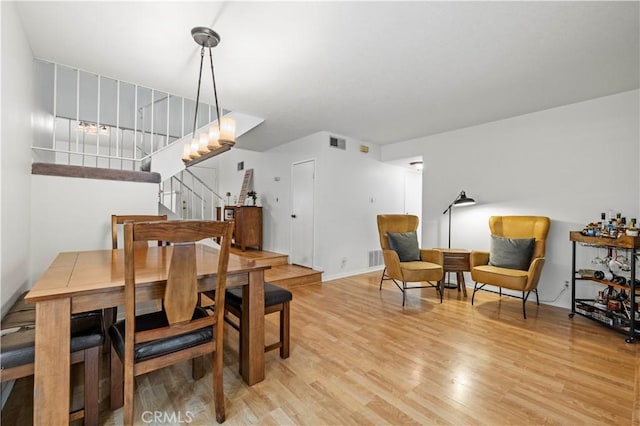 21643 Spice Ct, Saugus, CA 91350 - dining space featuring stairs and light wood-type flooring