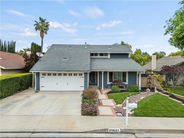 21643 Spice Ct, Saugus, CA 91350 - traditional-style home featuring a porch, driveway, roof with shingles, a front yard, and a garage