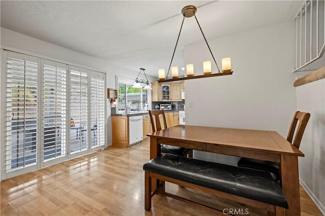21643 Spice Ct, Saugus, CA 91350 - dining area featuring light wood finished floors