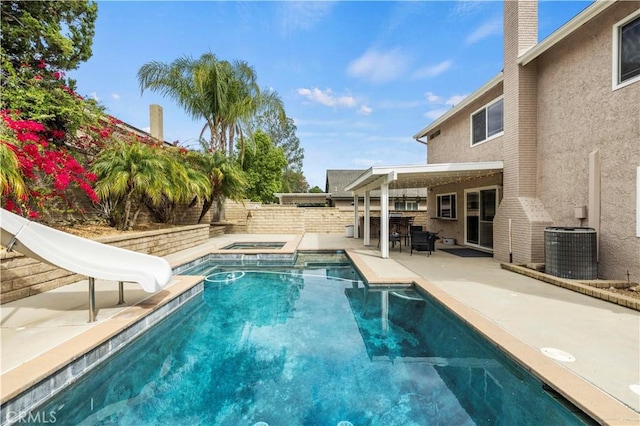 21643 Spice Ct, Saugus, CA 91350 - view of pool featuring an in-ground hot tub, a patio area, a water slide, and a fenced backyard