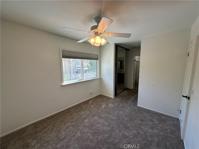 21643 Spice Ct, Saugus, CA 91350 - unfurnished bedroom with dark colored carpet and a ceiling fan