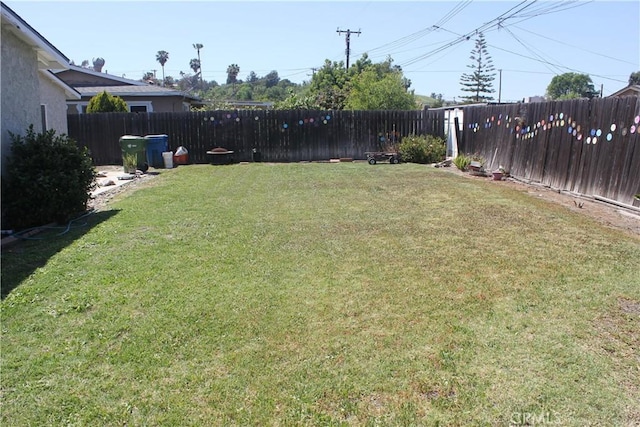 view of yard featuring a fenced backyard