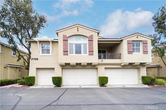 27518 Hazelhurst St Unit 1, Murrieta, CA 92562 - multi unit property featuring stucco siding, a garage, a balcony, and a tile roof