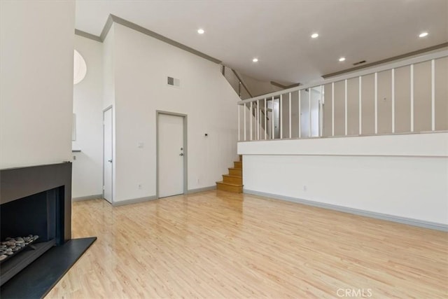 4730 Ben Ave Unit 3, Valley Village, CA 91607 - unfurnished living room featuring stairs, wood finished floors, ornamental molding, visible vents, and recessed lighting