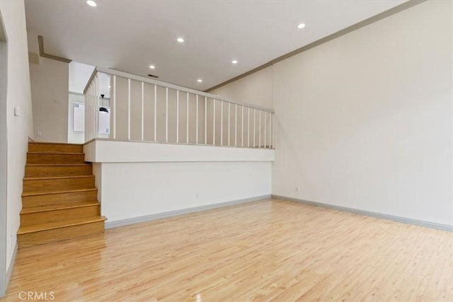4730 Ben Ave Unit 3, Valley Village, CA 91607 - unfurnished living room featuring stairway, ornamental molding, and wood finished floors