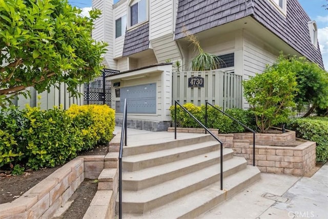 4730 Ben Ave Unit 3, Valley Village, CA 91607 - property entrance featuring fence, mansard roof, and a garage
