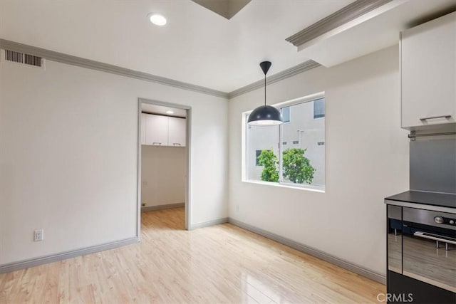 4730 Ben Ave Unit 3, Valley Village, CA 91607 - unfurnished dining area with baseboards, crown molding, visible vents, and light wood-style flooring