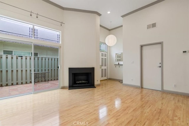 4730 Ben Ave Unit 3, Valley Village, CA 91607 - unfurnished living room with baseboards, wood finished floors, visible vents, and crown molding