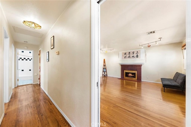 228 S Norman Ave, Fullerton, CA 92831 - hallway with baseboards, wood finished floors, and visible vents
