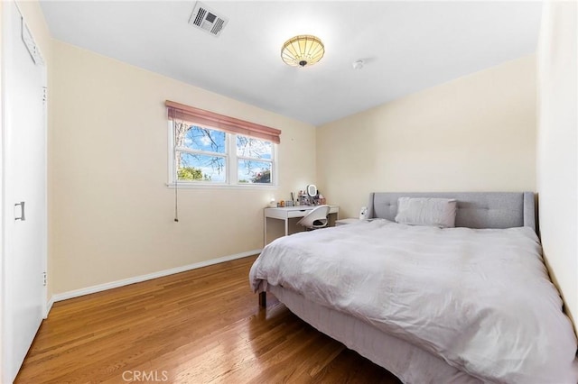 228 S Norman Ave, Fullerton, CA 92831 - bedroom with baseboards, wood finished floors, and visible vents