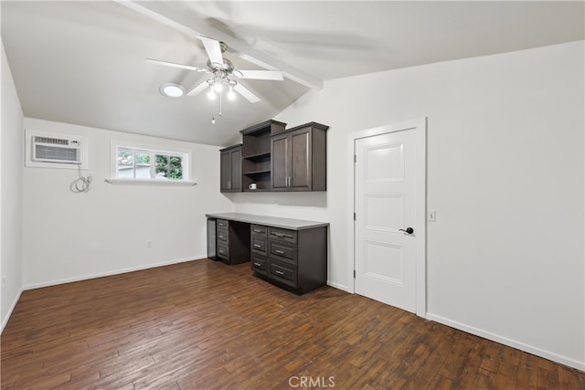 unfurnished office with lofted ceiling with beams, dark wood-style flooring, baseboards, a wall mounted air conditioner, and ceiling fan