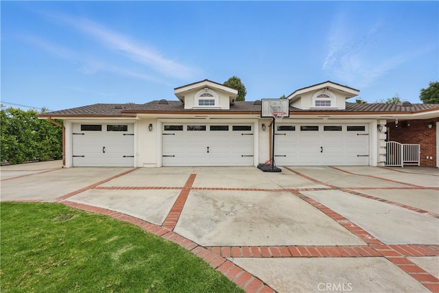 garage with concrete driveway