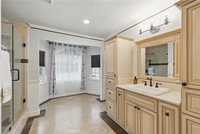 bathroom featuring a shower stall, crown molding, vanity, baseboards, and recessed lighting