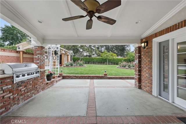 view of patio with exterior kitchen, grilling area, a ceiling fan, and fence