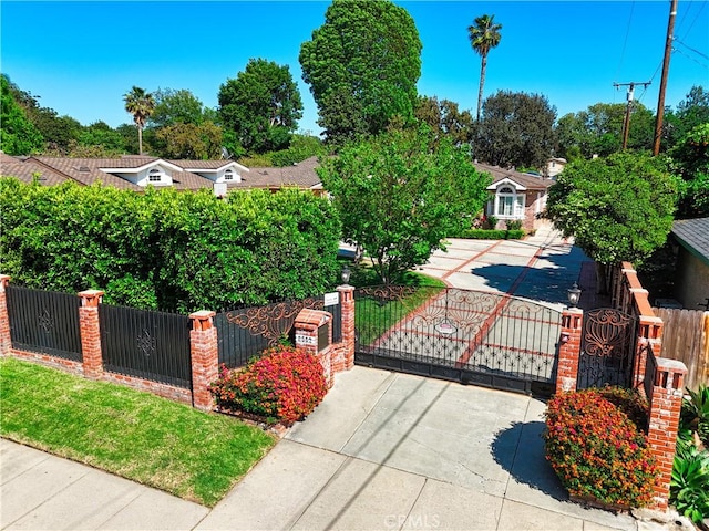 view of gate featuring a fenced front yard