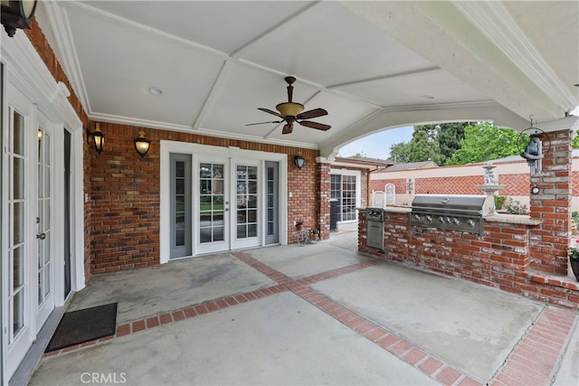 view of patio / terrace featuring french doors, an outdoor kitchen, area for grilling, and a ceiling fan