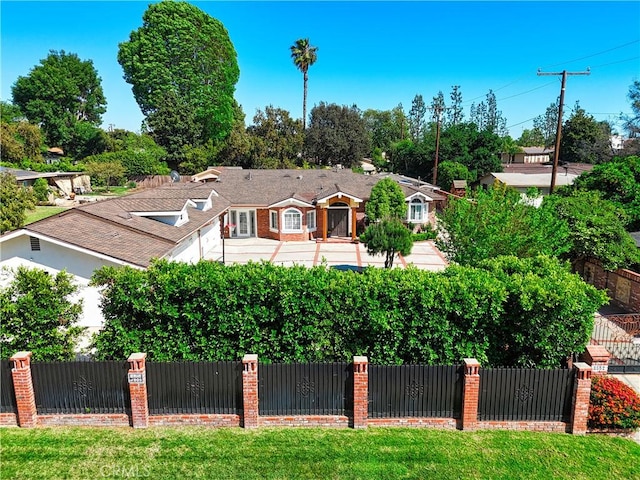 view of front of home with fence private yard