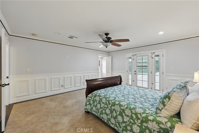 bedroom featuring visible vents, a decorative wall, wainscoting, access to outside, and ceiling fan