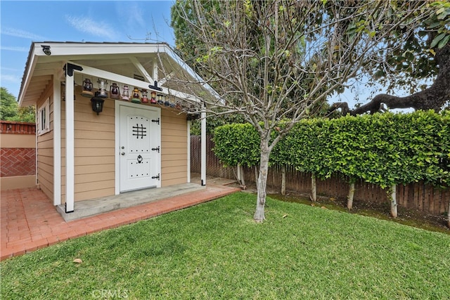 view of outbuilding featuring a fenced backyard and an outdoor structure