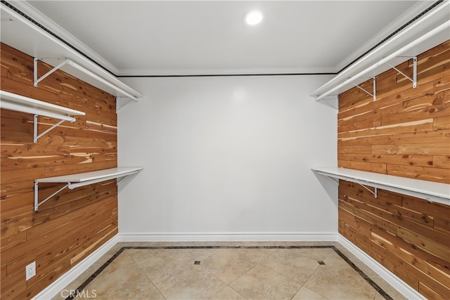 spacious closet with tile patterned floors