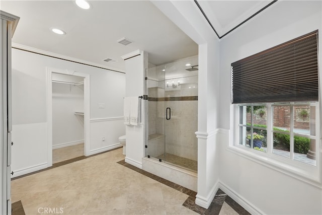 full bathroom with baseboards, toilet, visible vents, and a stall shower