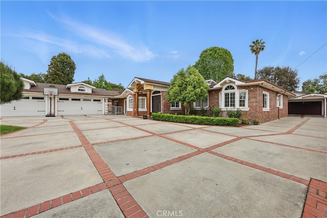 ranch-style house with driveway and brick siding