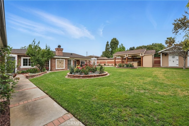 exterior space featuring a gazebo, a chimney, and a front lawn