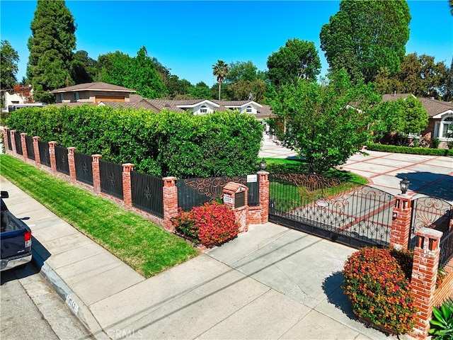 exterior space with a gate and a fenced front yard