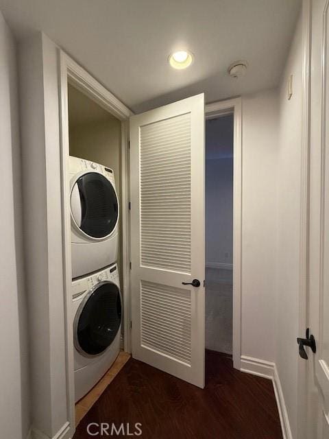 855 Wilcox Ave Unit 103, Los Angeles, CA 90038 - laundry area with estacked washer and dryer, dark wood-type flooring, and recessed lighting