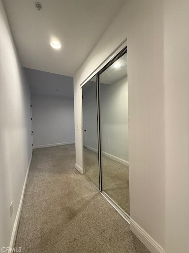 855 Wilcox Ave Unit 103, Los Angeles, CA 90038 - hallway with carpet floors and baseboards