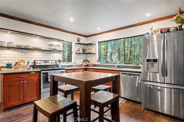kitchen with tasteful backsplash, crown molding, open shelves, dark wood-type flooring, and appliances with stainless steel finishes