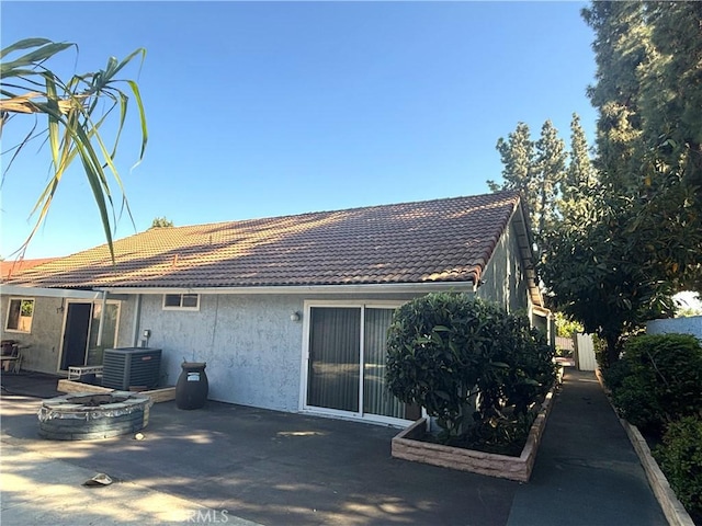 1193 W Molly Ct, Upland, CA 91786 - back of property with central air condition unit, a tile roof, a patio, and stucco siding