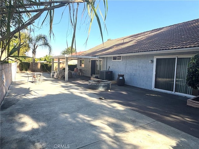 1193 W Molly Ct, Upland, CA 91786 - back of house with a tile roof, central AC unit, fence, a patio, and stucco siding
