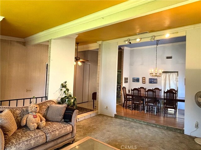 1193 W Molly Ct, Upland, CA 91786 - carpeted living room featuring visible vents, ornamental molding, and ceiling fan with notable chandelier