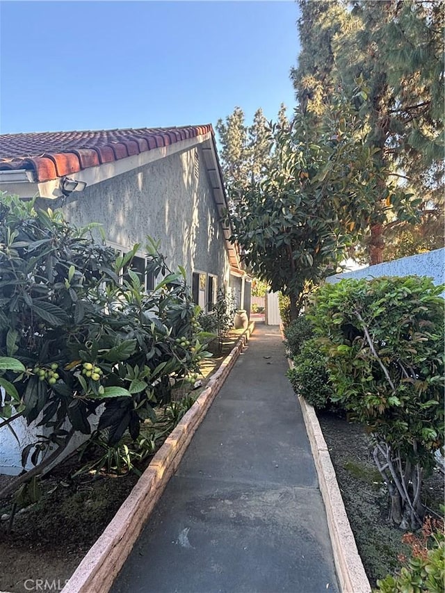1193 W Molly Ct, Upland, CA 91786 - view of property exterior featuring stucco siding and a tile roof