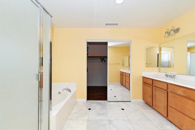 15785 Approach Ave, Chino, CA 91708 - full bathroom featuring a bath, visible vents, baseboards, a shower stall, and vanity
