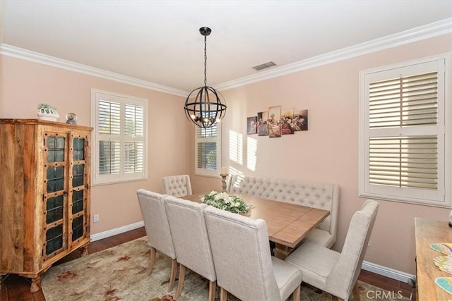 15785 Approach Ave, Chino, CA 91708 - dining area with wood finished floors, visible vents, crown molding, baseboards, and a chandelier