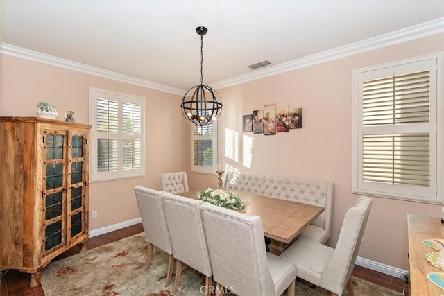 15785 Approach Ave, Chino, CA 91708 - dining space featuring a chandelier, crown molding, and wood finished floors