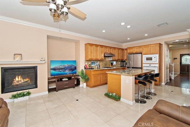 15785 Approach Ave, Chino, CA 91708 - kitchen featuring ornamental molding, visible vents, a ceiling fan, and stainless steel appliances