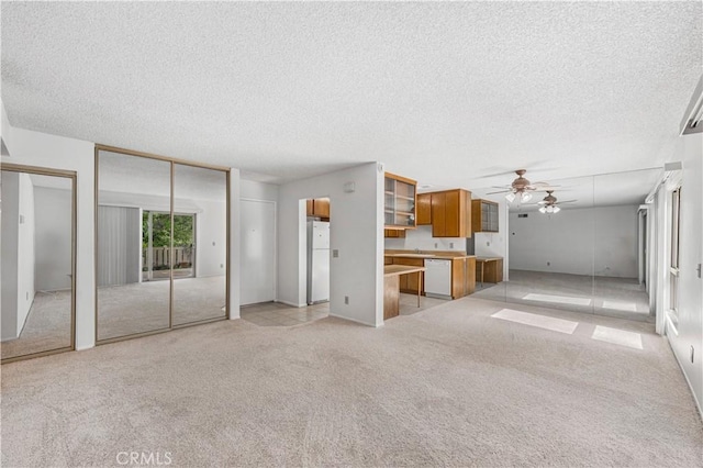 254 Sequoia Ct Unit 12, Thousand Oaks, CA 91360 - unfurnished living room featuring a textured ceiling, light carpet, and ceiling fan