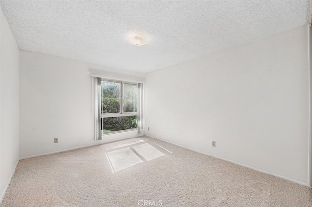 254 Sequoia Ct Unit 12, Thousand Oaks, CA 91360 - carpeted spare room featuring baseboards and a textured ceiling