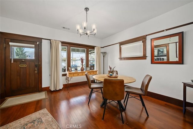 1339 Higuera St, San Luis Obispo, CA 93401 - dining room with dark wood-style floors, visible vents, baseboards, and an inviting chandelier