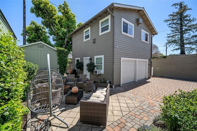 1339 Higuera St, San Luis Obispo, CA 93401 - back of property featuring fence, cooling unit, a patio, decorative driveway, and a garage