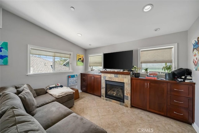 1339 Higuera St, San Luis Obispo, CA 93401 - living room featuring recessed lighting, vaulted ceiling, a tile fireplace, and light tile patterned floors