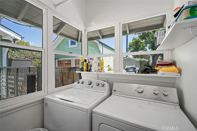 1339 Higuera St, San Luis Obispo, CA 93401 - washroom with washing machine and clothes dryer, a wealth of natural light, and laundry area