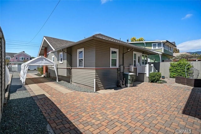 1339 Higuera St, San Luis Obispo, CA 93401 - view of front of house featuring fence and a detached carport
