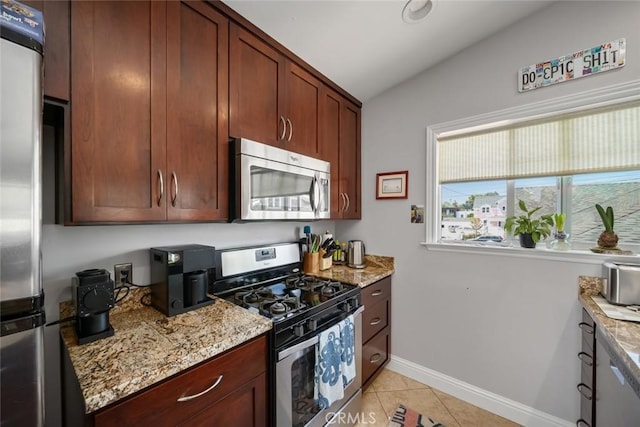1339 Higuera St, San Luis Obispo, CA 93401 - kitchen featuring light stone counters, vaulted ceiling, light tile patterned flooring, and stainless steel appliances