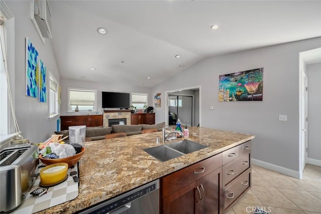 1339 Higuera St, San Luis Obispo, CA 93401 - kitchen featuring recessed lighting, lofted ceiling, light stone counters, a sink, and a tiled fireplace