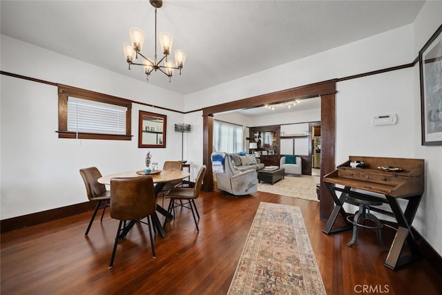 1339 Higuera St, San Luis Obispo, CA 93401 - dining area with dark wood-style floors and an inviting chandelier